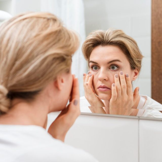 https://hormonehub.org/wp-content/uploads/2024/08/woman-checking-her-eyes-mirror_23-2148537395-640x640.jpg